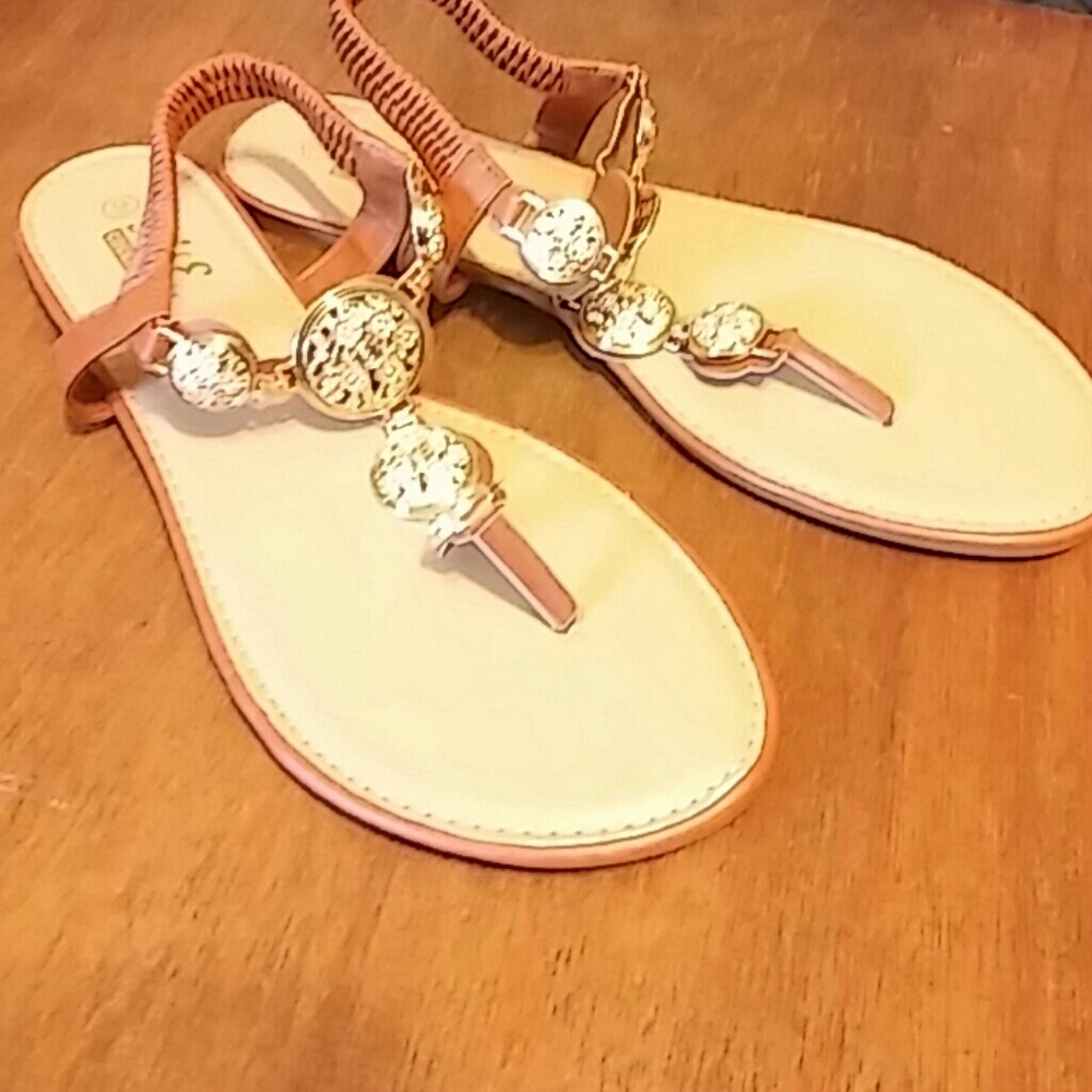 Gold medallion flip flops